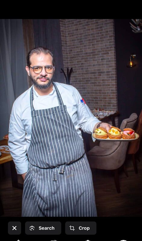 Chef Amer Ilbahre with a plate of pastries