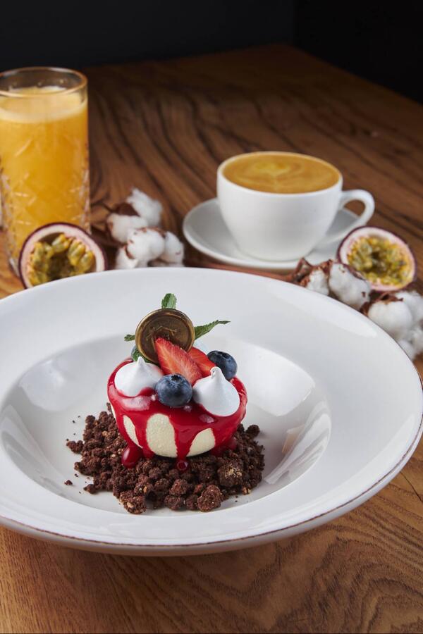 Plated dessert with berries and meringue