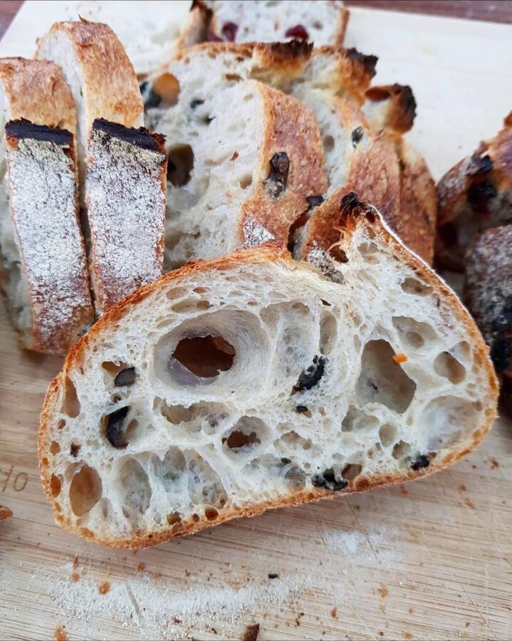 Sliced artisan sourdough with olives
