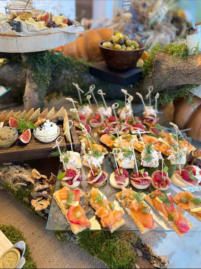 Canapé and catering display with figs, olives and smoked salmon